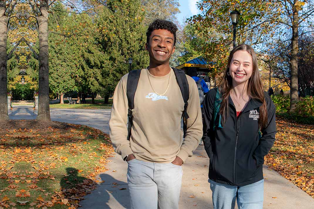 Two students walking on campus