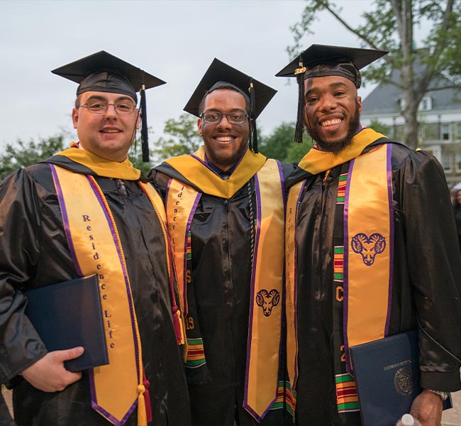 hree graduates in their cap and gowns