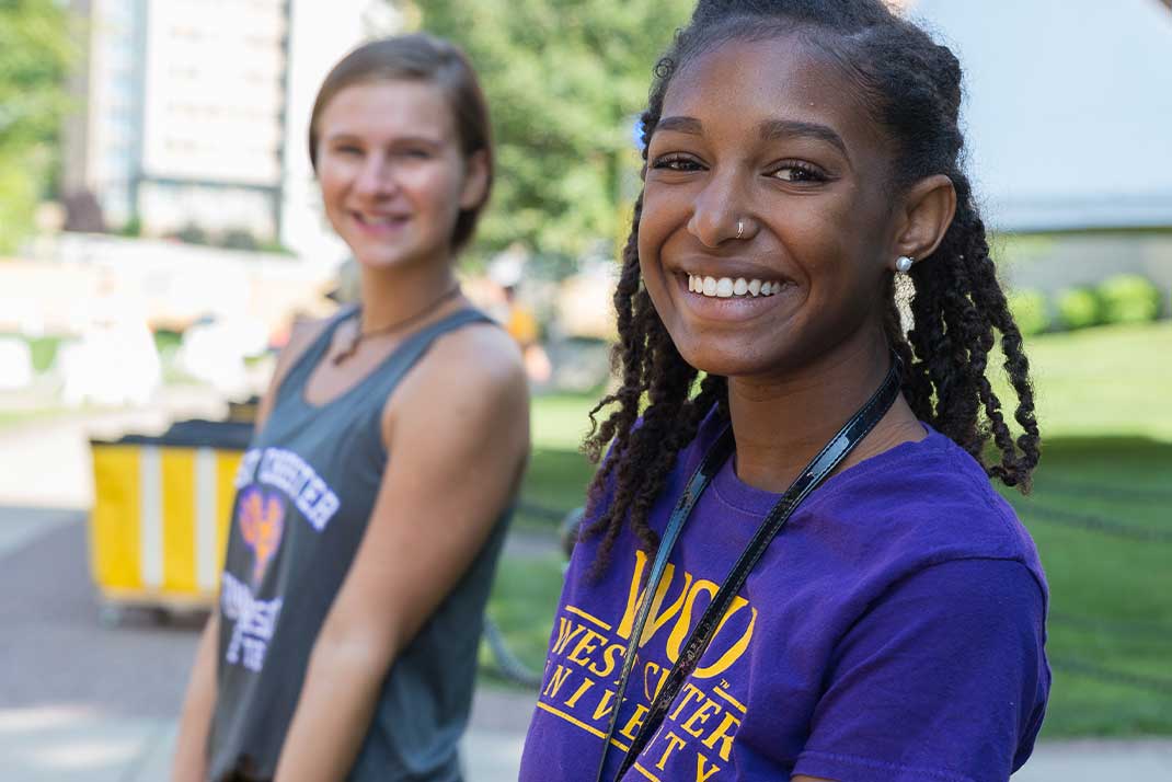 Student moving into dorm