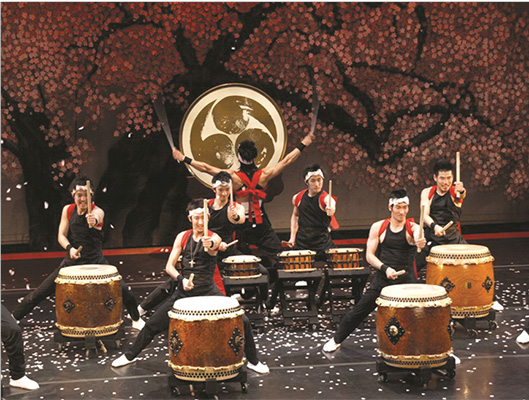 small group of Japanese Taiko drummers during their performance.
