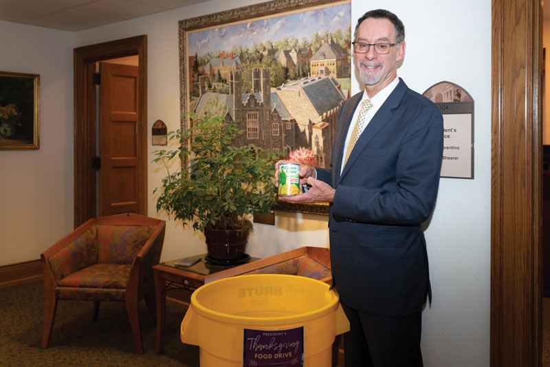 Chris Fiorentino holding a can of food to be donated to the WCU pantry.