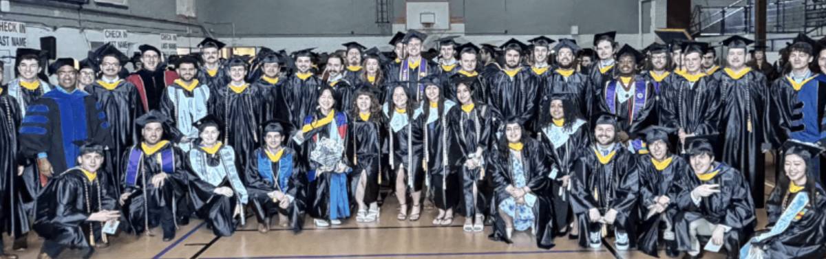 Group picture of students in graduation gowns