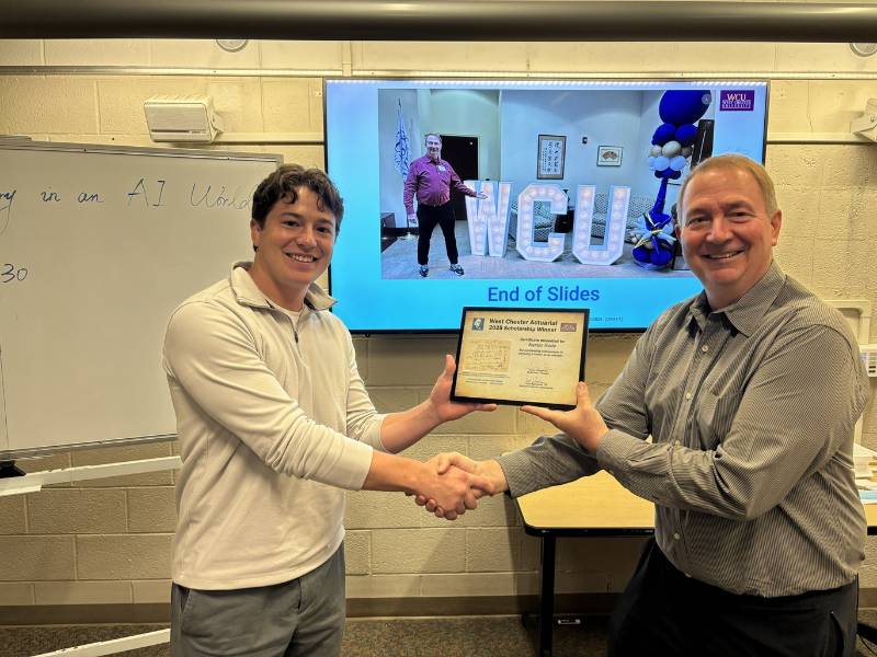 John Buchanan presenting the 2025 West Chester Actuarial Scholarship to Karter Rude
