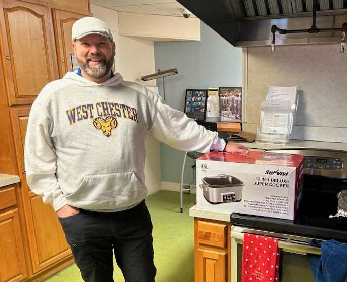 John Crouser (President-pictured with Super Cooker)
